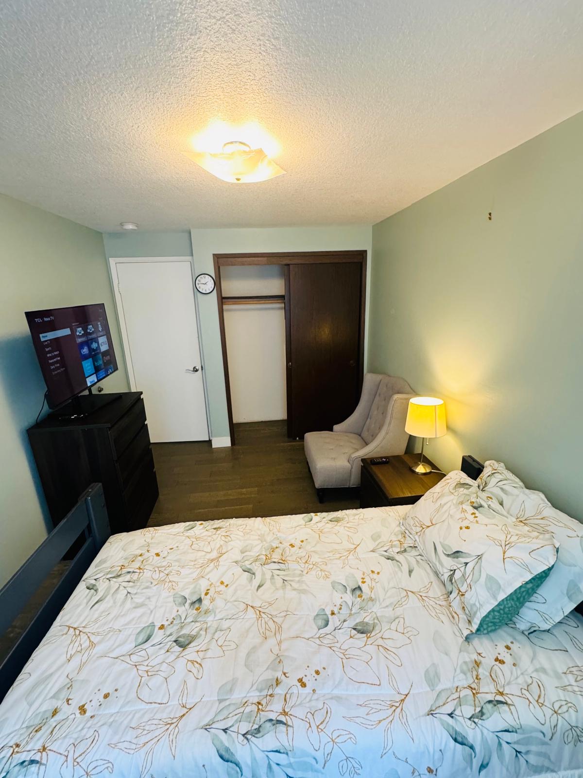 Bedroom interior at Bramig Adult Care Home with functional and warm design.