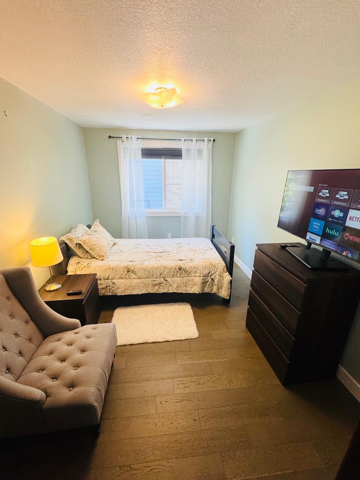 Calm and cozy bedroom space for residents at Bramig Adult Care Home.