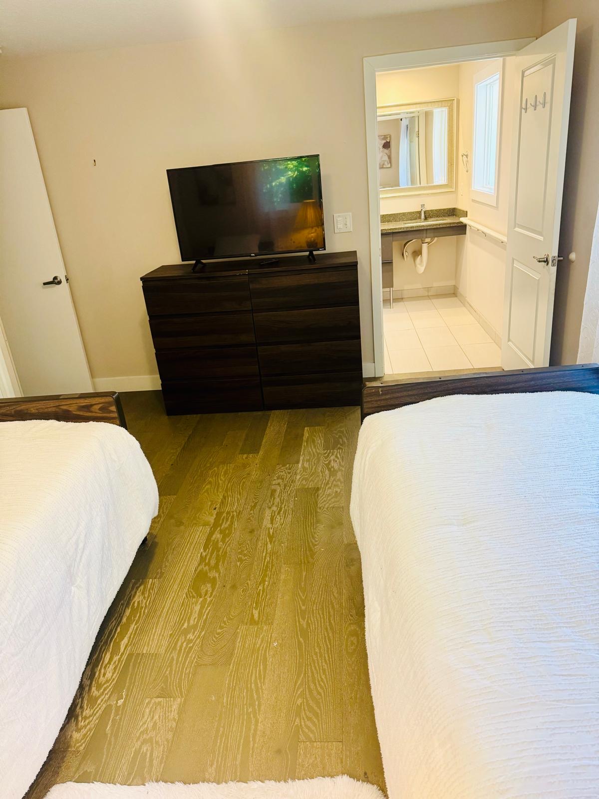 Resident bedroom at Bramig Adult Care Home with cozy furnishings.
