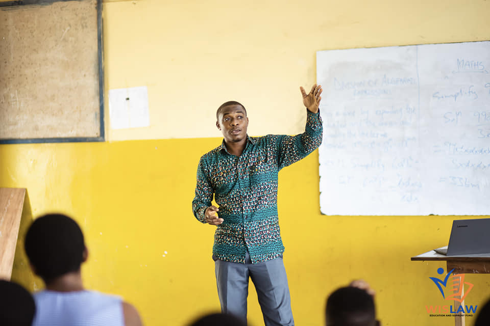 Image of our manager speaking to the students