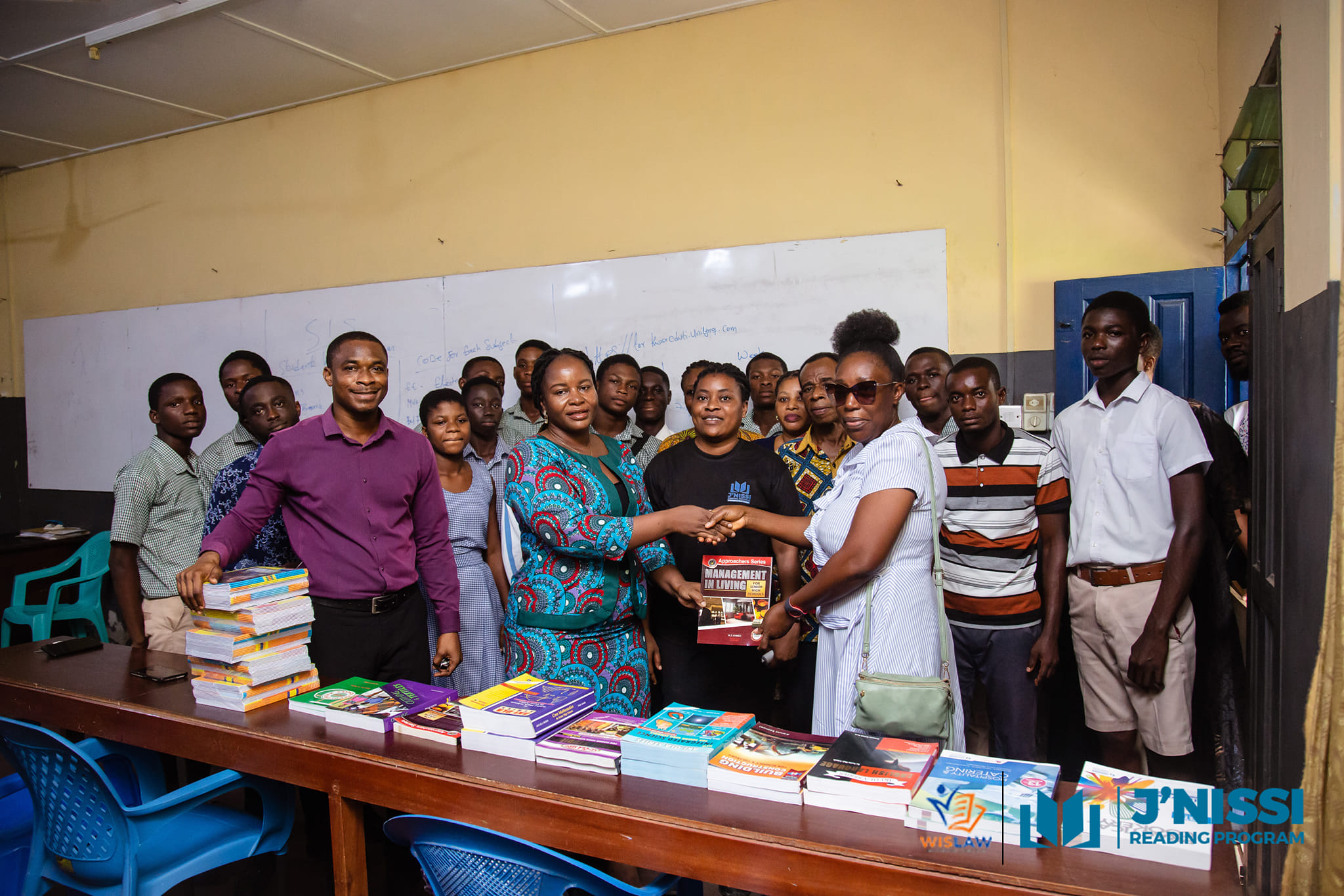 Lawrencia presenting donated books