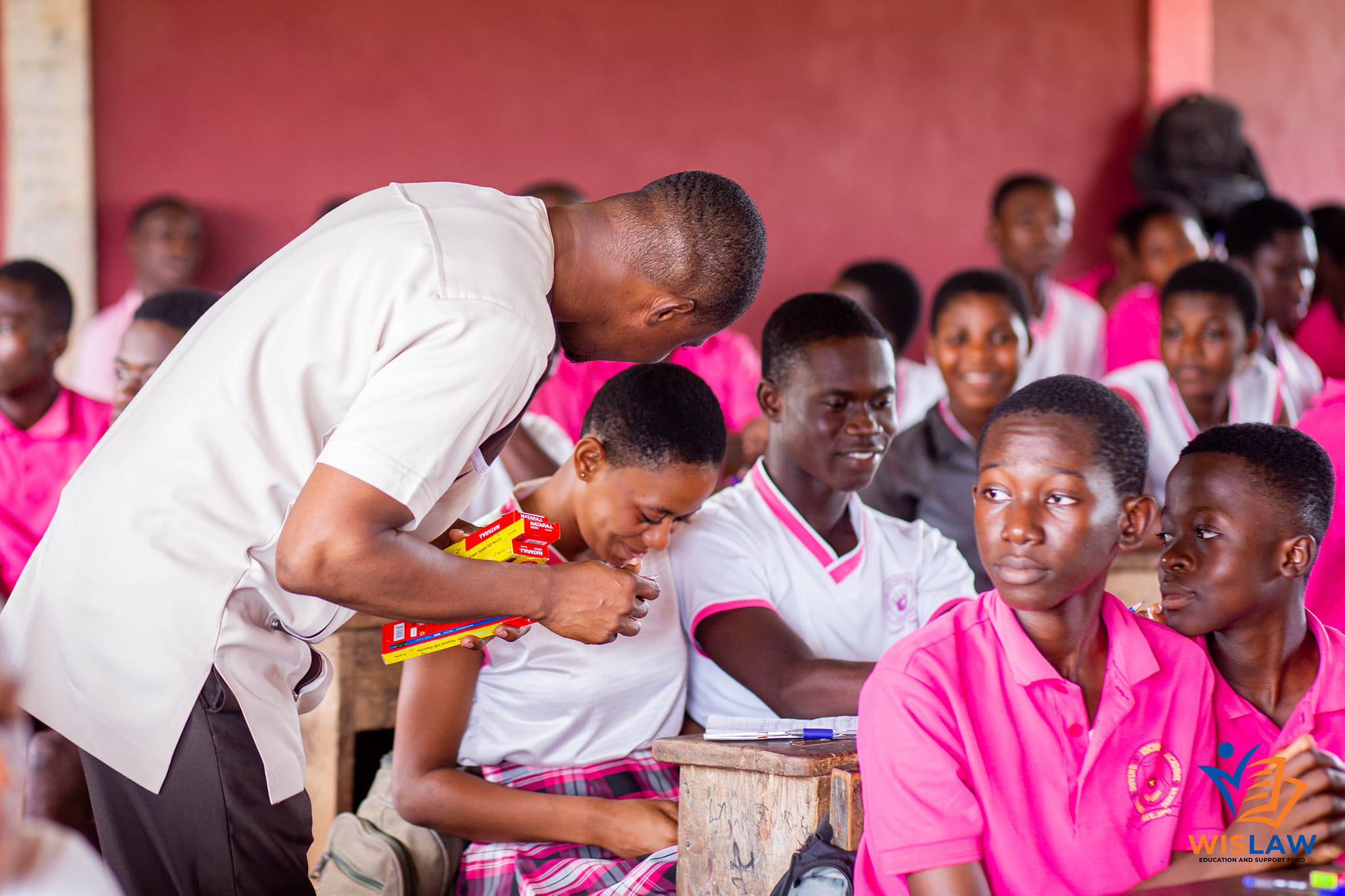 wislaw manager sitting beside a student