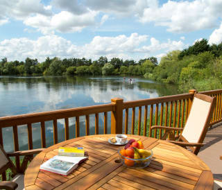 A view of the lake from one of our stunning lodges at Tattershall Lakes on a sunny day.