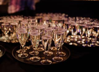 Prosecco glasses available for guests at a corporate event. image