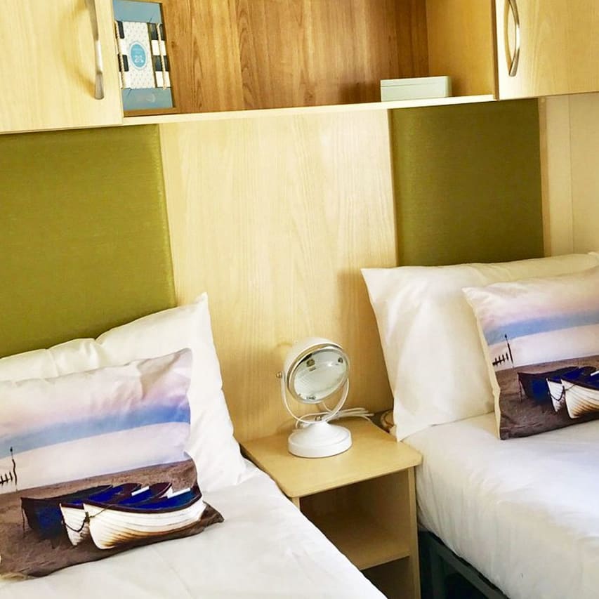 The twin bedroom in our bright and spacious superior static caravan. The perfect way to stay.