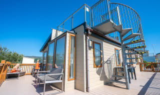 The exterior of one of our bright and spacious Exclusive Rooftop Lodge at our stunning park in North Wales, Barmouth Bay. Book your break today! image