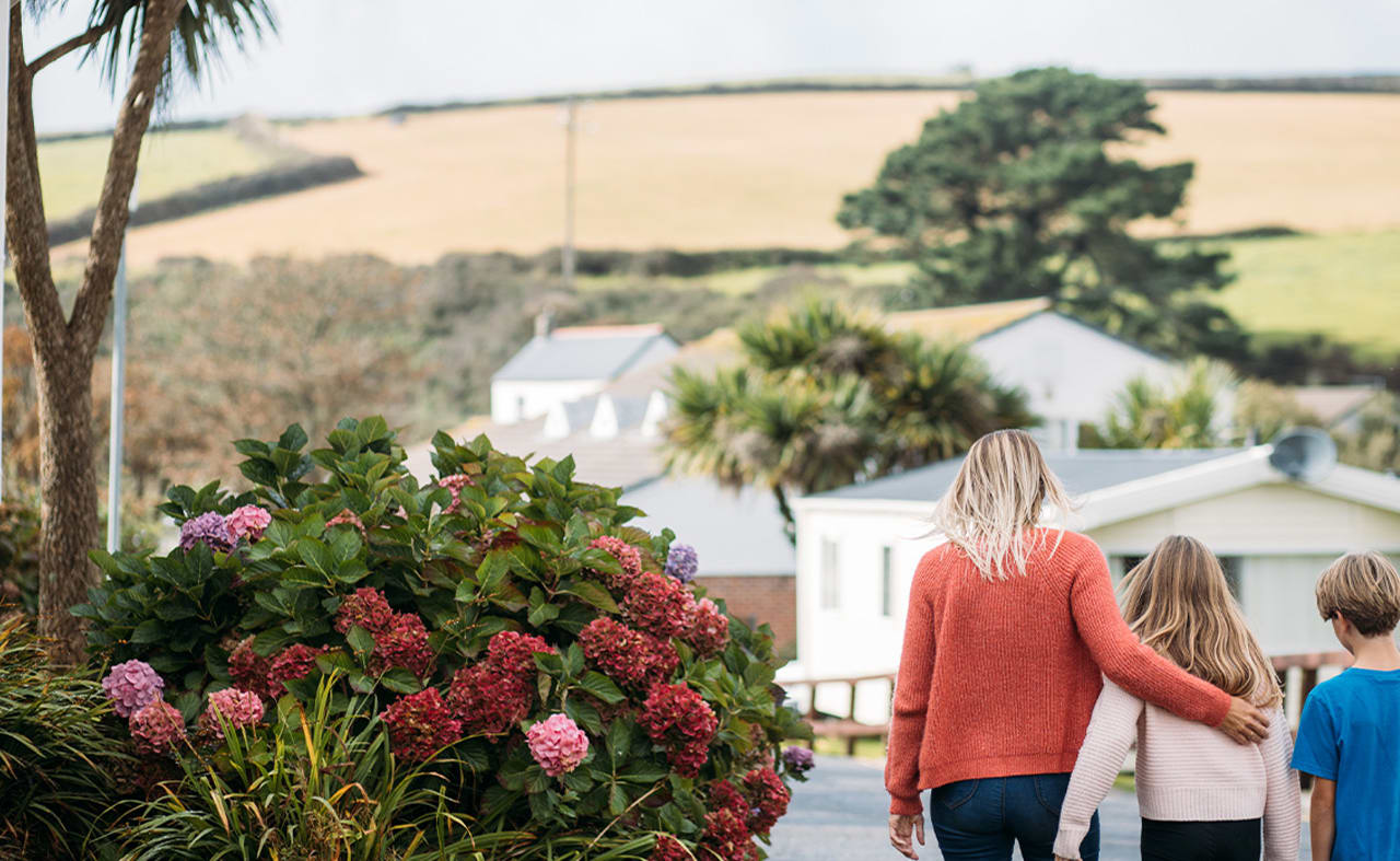 Family visiting Newquay Bay Holiday Park during the autumn months. image