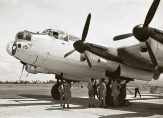 A black and white image of a plane from WW2. image