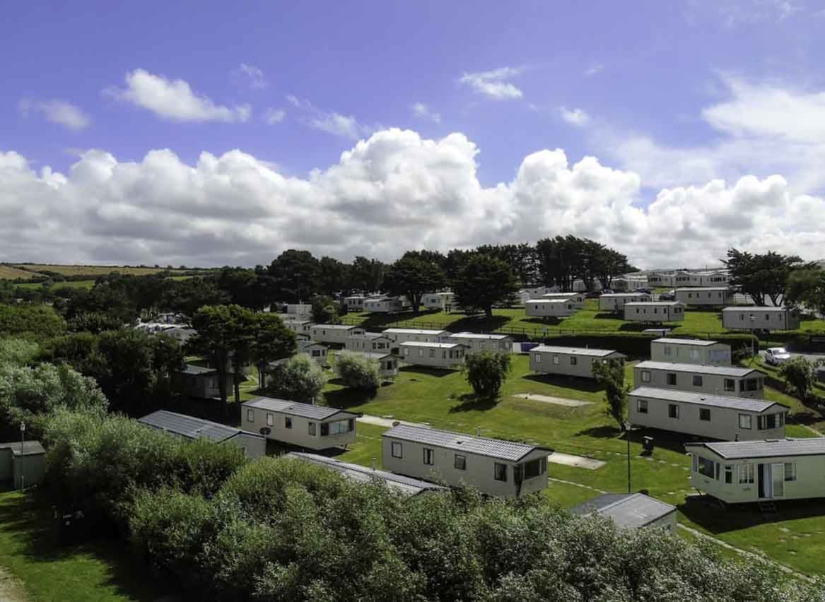An aerial shot of a selection of caravans at Away Resorts Newquay Bay park. image