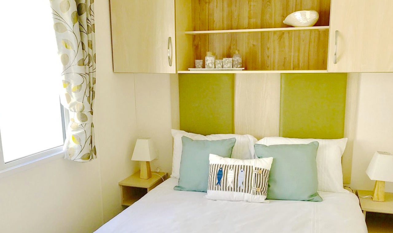 The double bedroom in our bright and spacious superior static caravan. The perfect way to stay. image