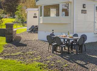 The exterior of a static caravan at our Moffat Manor holiday park in a summers day. image