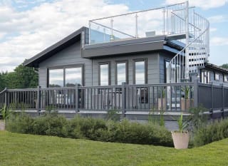 The exterior of our stunning Luxury Lodge with a roof terrace at Swanage Bay View, Dorset. Book your holiday now! image