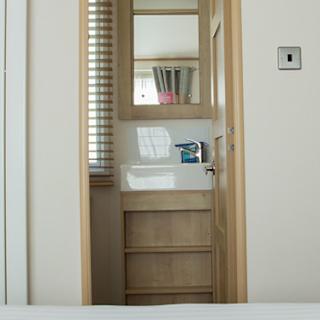 The double bedroom with en suite bathroom in our bright and spacious indulgent static caravan. The perfect way to stay.