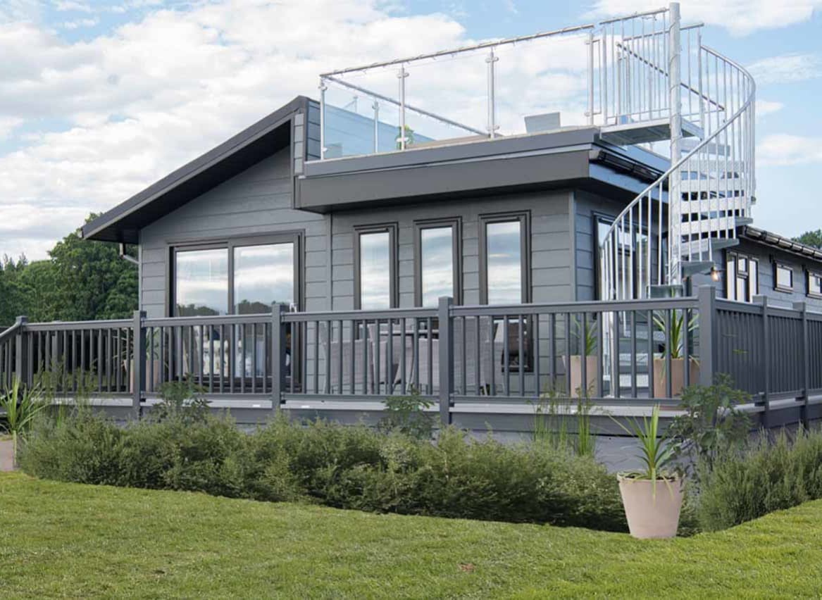 The exterior of our stunning Luxury Lodge with a roof terrace at Swanage Bay View, Dorset. Book your holiday now! image