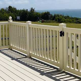 The decking area on a sunny day at one of our exclusive accommodations, The Seaview Lodge. Book your holiday now!