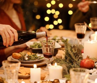 A close up of people enjoying a Christmas dinner