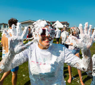 A hot summer day with a group of people covered in custard pie! As part of the many events and activities we offer at our holiday parks. image
