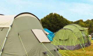 Two tents pitched at one of our holiday parks. image