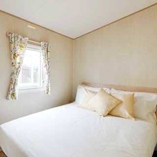 The double bedroom in our bright and spacious comfort static caravan. The perfect way to stay.