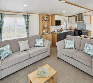 The lounge area of our bright and spacious luxury static caravan. The perfect way to stay. image