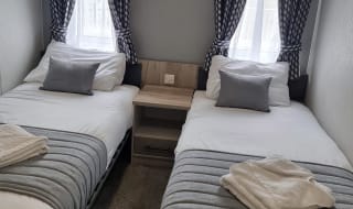 The twin bedroom of one of our exclusive accommodations, The Seaview Lodge. Book your holiday now! image