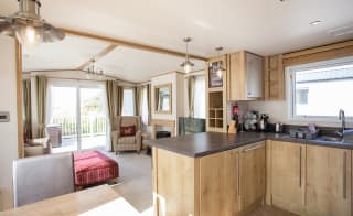 The living area of our bright and spacious indulgent static caravan. The perfect way to stay. image