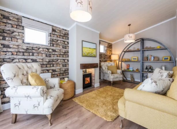 The lounge area of our bright and spacious luxury rooftop lodge at Swanage Bay View. The perfect way to stay. image