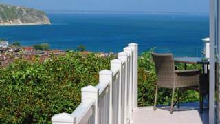 A view of the sea and surrounding area from the balcony of one of our stunning holiday homes at Swanage Bay View.