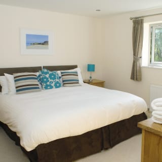 Comfortable double bed with pillows & linen included