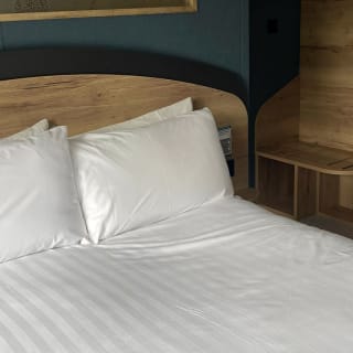 Comfortable double bed with pillows & linen included