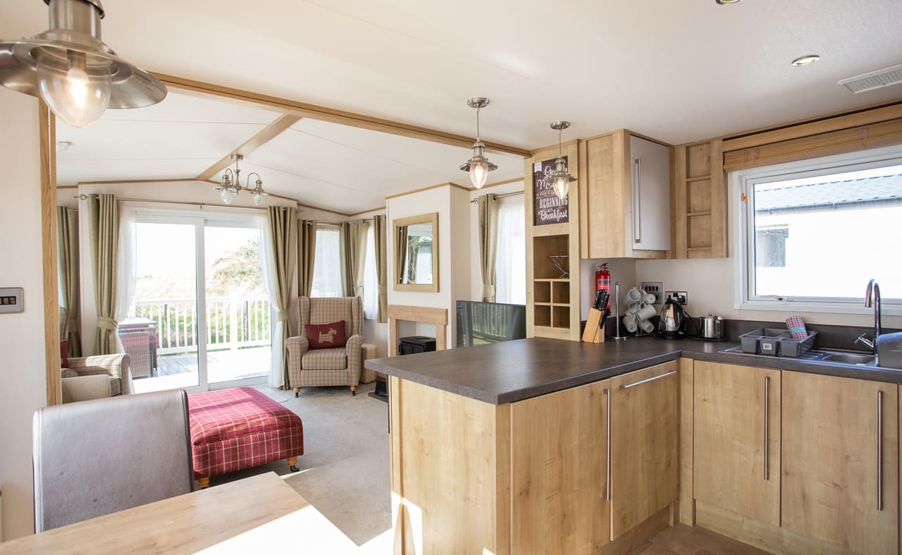 The living area of our bright and spacious indulgent static caravan. The perfect way to stay. image