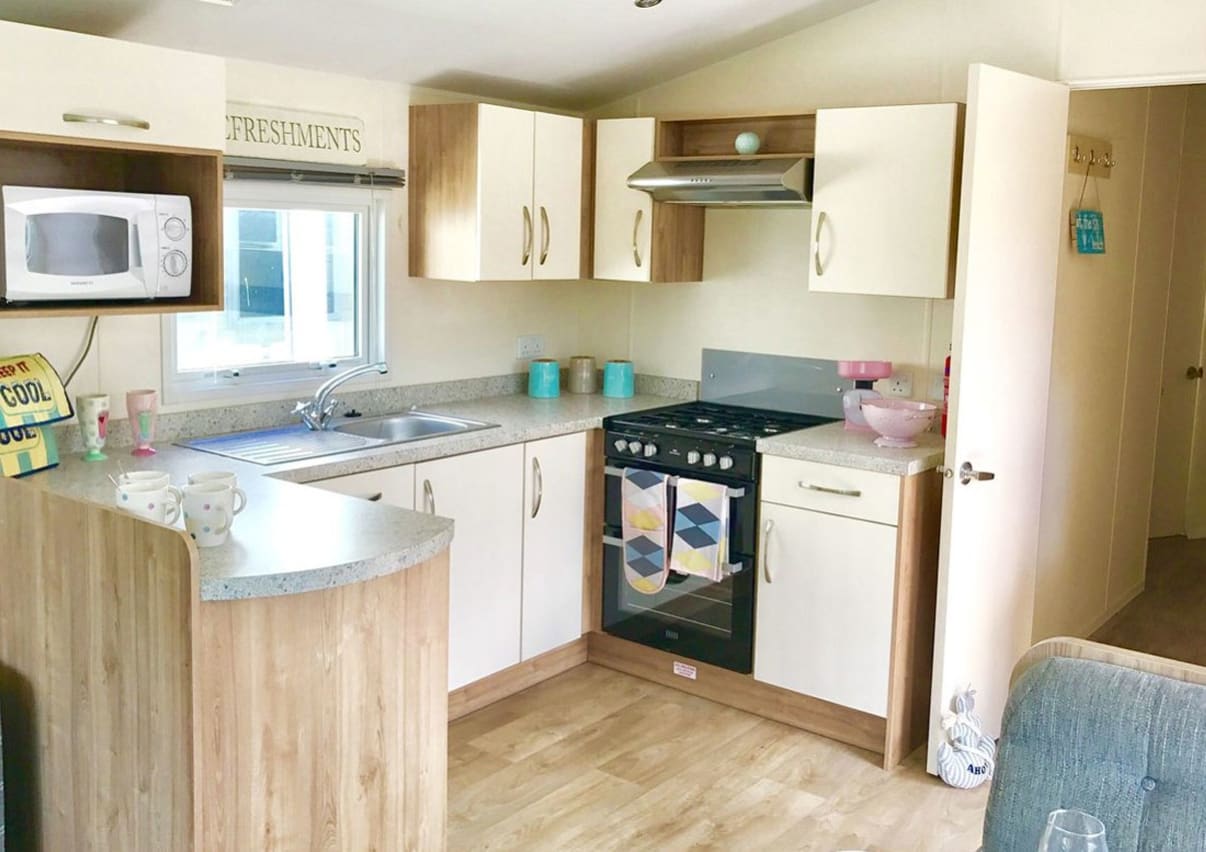 The kitchen area of our bright and spacious superior static caravan. The perfect way to stay.
