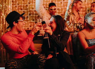 A group of people enjoying a party. image