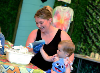 Mum and daughter creating their tie dye tops in one of our fun activities. image
