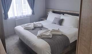 The double bedroom of one of our exclusive accommodations, The Seaview Lodge. Book your holiday now! image