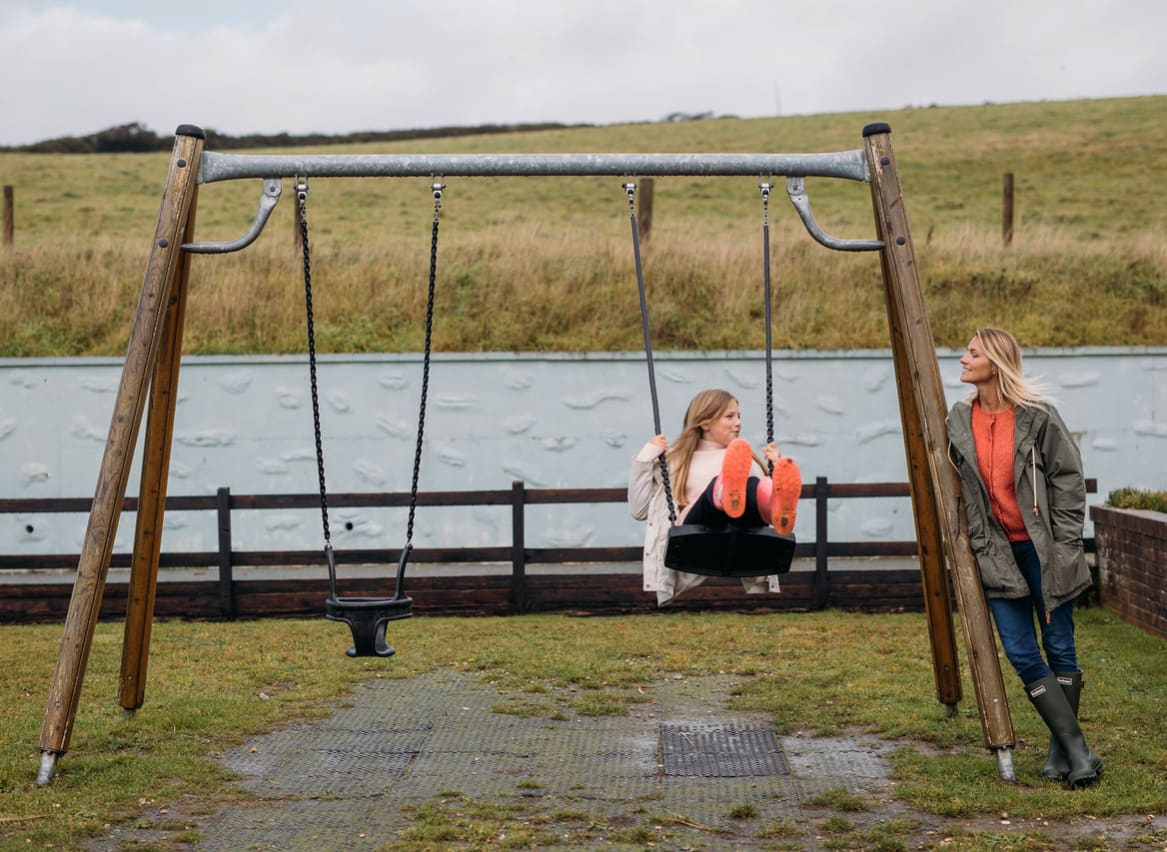 A mother and daughter in our adventure playground at Newquay Bay, Cornwall. image