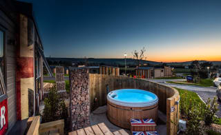 The exterior of our Exclusive Rocktar with hot tub. Book your holiday now! image
