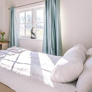 Comfortable double bed with towels, pillows & linen included
