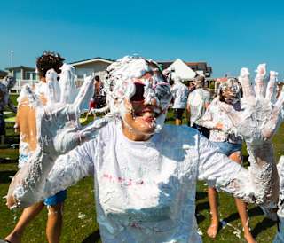 A hot summer day with a group of people covered in custard pie! As part of the many events and activities we offer at our holiday parks.