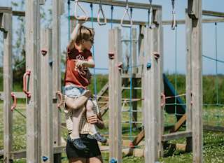 A child playing in the park at Newperran, Cornwall. image