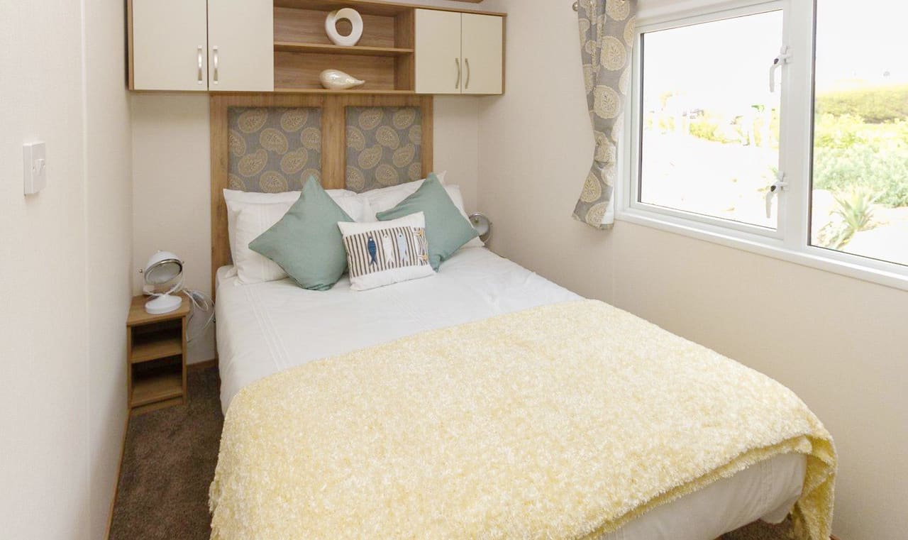The double bedroom of our bright and spacious luxury static caravan. The perfect way to stay. image