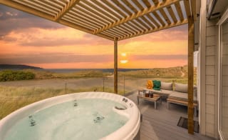 The hot tub at our stunning accommodation at our holiday park St Ives Bay with stunning sea views. image