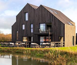 Exterior of our exclusive barn accommodation overlooking our lakes.