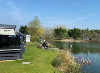 A couple of men fishing at our stunning lakeside resort, Tattershall Lakes. image