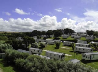 An aerial shot of a selection of caravans at Away Resorts Newquay Bay park. image