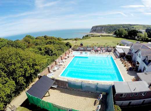 A hot summer's day overlooking our outdoor pool at Whitecliff Bay. Come see for yourself when you visit the Isle of Wight on your next caravan holiday.