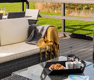 Exterior of barn area at Retallack Resort and Spa overlooking the lake and beautiful Cornish countryside.