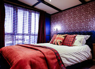 The master bedroom of one of our exclusive accommodations, The Rockstar. Book your holiday now! image
