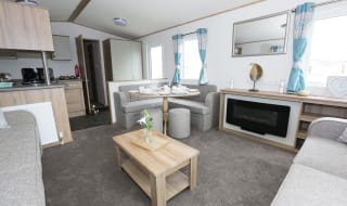 The lounge area of our bright and spacious luxury static caravan. The perfect way to stay. image