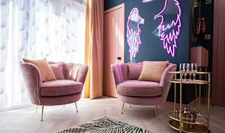 The instagrammable lounge area in the Esme. Sporting two pink plush velvet seats, neon lighting and a gold drinks trolley. The perfect way to stay!